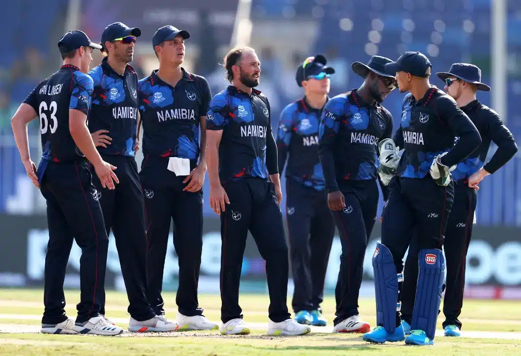 Namibia cricket players standing in the field after win